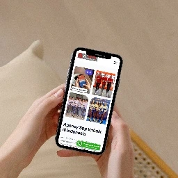 Modern office building exterior with large windows and gray facade